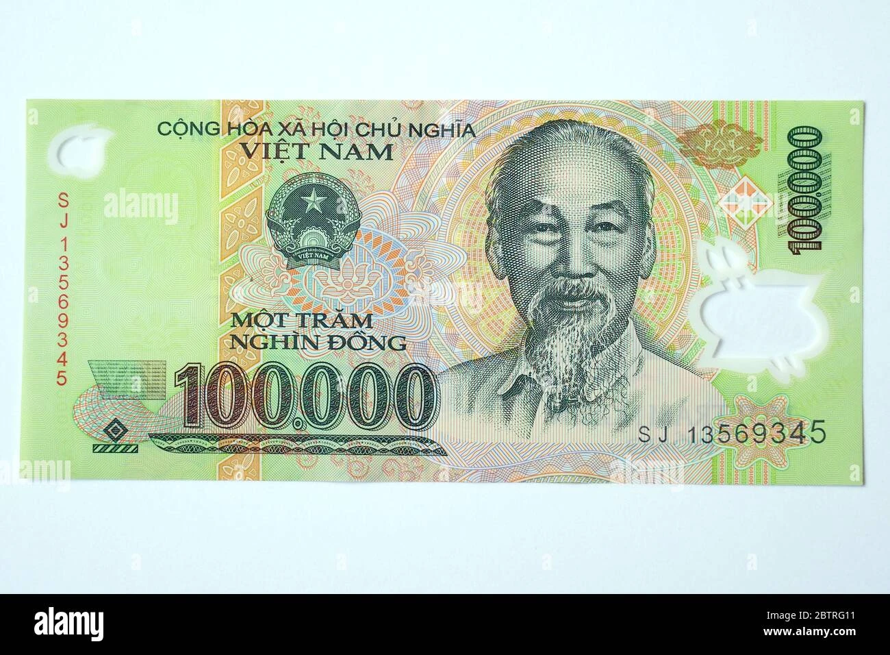 Hình ảnh đồng 100.000 đồng trong tay